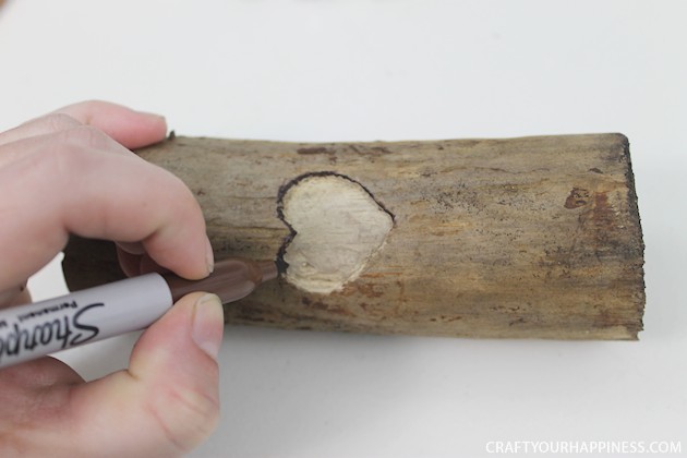 If you're looking for a unique gift idea for couples this darling carved sweetheart branch is perfect and inexpensive. You can make it with a couple of carving tools, which are cheap, and a marker. Or if you happen to own a rotary or Dremel tool and/or a wood burner, you can use those. We show both ways of making it.