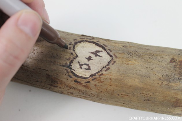 If you're looking for a unique gift idea for couples this darling carved sweetheart branch is perfect and inexpensive. You can make it with a couple of carving tools, which are cheap, and a marker. Or if you happen to own a rotary or Dremel tool and/or a wood burner, you can use those. We show both ways of making it.