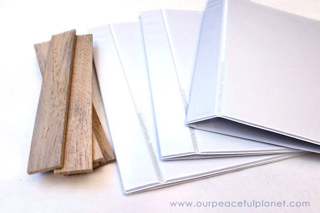 Make super cheap & creative wall mounted file holders using 3 ring binders! We’ve got free printables so you can turn yours into a homework helper set!