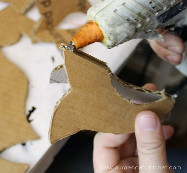 Add a little whimsy to any room with a cardboard chandelier! Grab our free pattern, some cardboard , a hot glue gun and paint. Add any bling you like! 