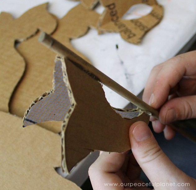 Add a little whimsy to any room with a cardboard chandelier! Grab our free pattern, some cardboard , a hot glue gun and paint. Add any bling you like! 