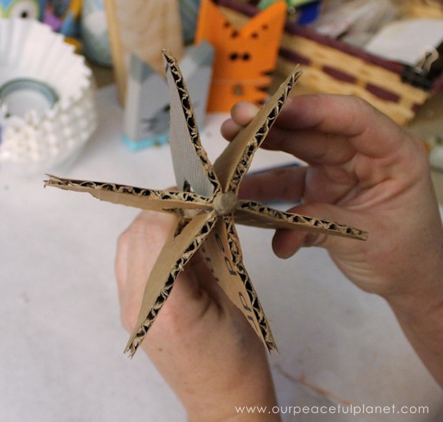 Add a little whimsy to any room with a cardboard chandelier! Grab our free pattern, some cardboard , a hot glue gun and paint. Add any bling you like! 