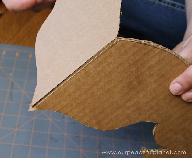 Add a little whimsy to any room with a cardboard chandelier! Grab our free pattern, some cardboard , a hot glue gun and paint. Add any bling you like! 