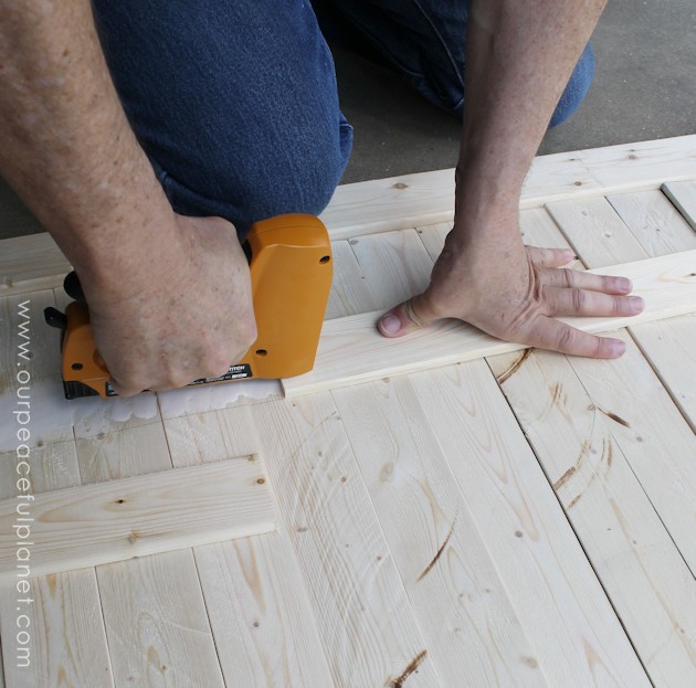Add some whimsy to your home with this easy DIY picket fence fireplace cover. Made with wood slats and some hinges you can decorate it for any season. 