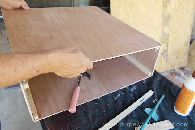 Can't find a large enough kitchen trash can to fit a space? You can make one on wheels to fit any spot! All you need are a few simple supplies and tools.