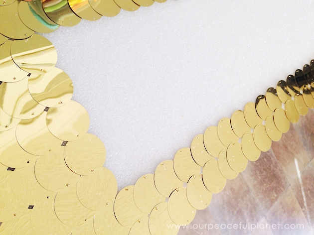 With a foam sheet, 40mm round gold sequins and hot glue you can make this awesome huge lightning bolt cheap wall decor statement piece. Shockingly gorgeous!