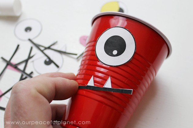 Make a creepy fun monster eye pong party game with plastic cups & ping pong balls. (Beer pong was never this awesome.) Kids & adults alike will love it!