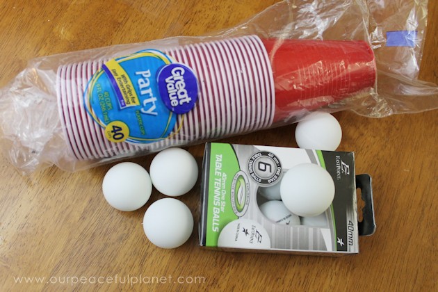 Make a creepy fun monster eye pong party game with plastic cups & ping pong balls. (Beer pong was never this awesome.) Kids & adults alike will love it!