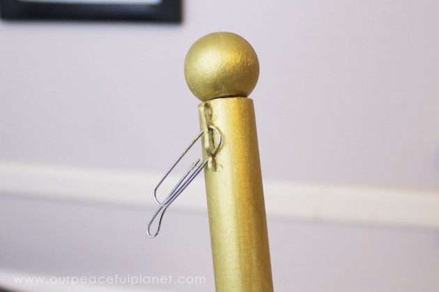 This classy display clip stand is made from a candle holder, dowel and bobby pin and it can not only display he free printable motivational quotes below but photos and more!
