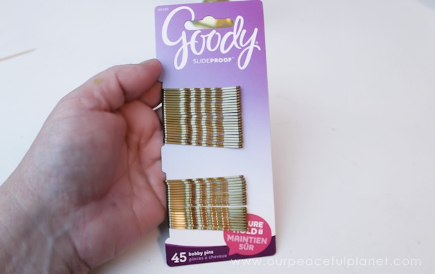This classy display clip stand is made from a candle holder, dowel and bobby pin and it can not only display he free printable motivational quotes below but photos and more!