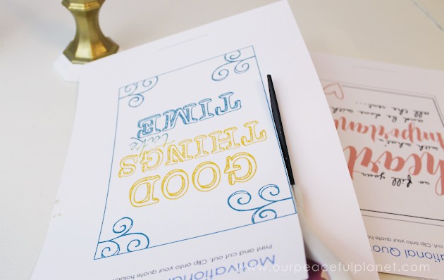 This classy display clip stand is made from a candle holder, dowel and bobby pin and it can not only display he free printable motivational quotes below but photos and more!