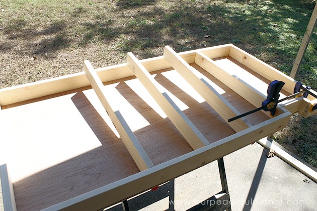 Build your own affordable pantry door organizer with some wood and a few basic tools. It's easier than you think and you'll love the extra storage!