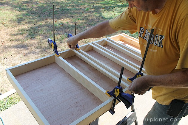 Build your own affordable pantry door organizer with some wood and a few basic tools. It's easier than you think and you'll love the extra storage!