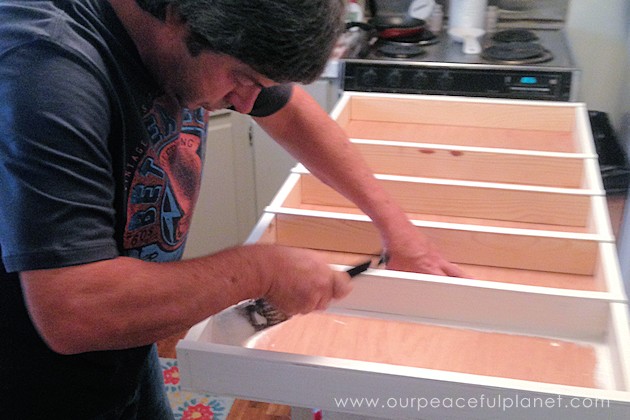 Build your own affordable pantry door organizer with some wood and a few basic tools. It's easier than you think and you'll love the extra storage!