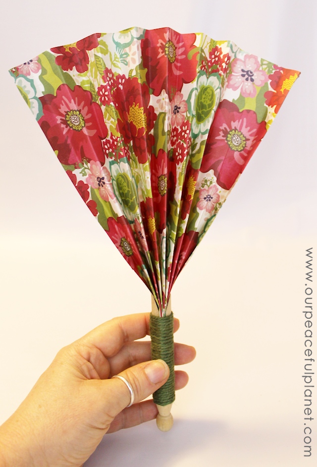 Make these quick hand fans in minutes using a regular wood clothespin and some heavy scrapbook paper. Wrap a little ribbon or twine around them and you have a beautiful way to cool off!