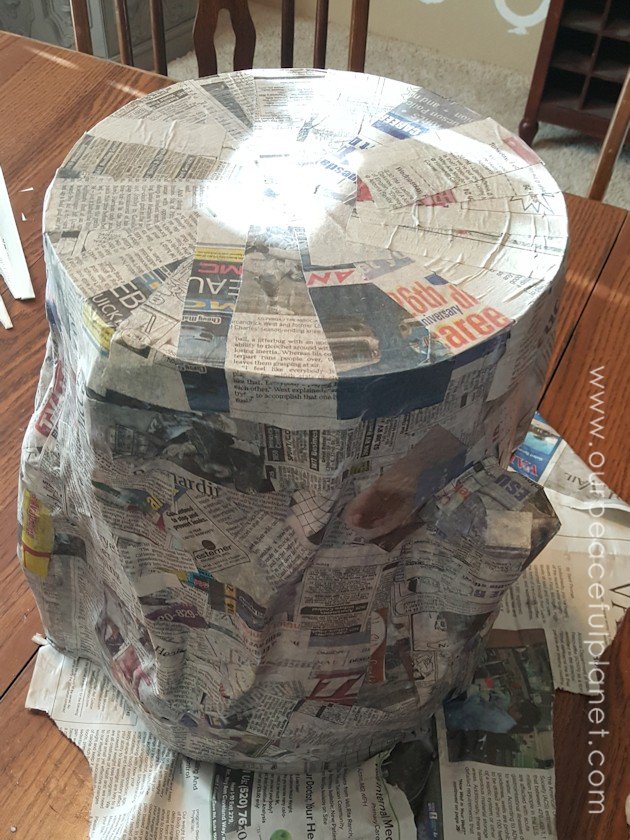 Add some whimsy to your home with this DIY tree stump stool. Remember using paper mache in grammar school? That's what creates the stump effect and it's easier than you think!