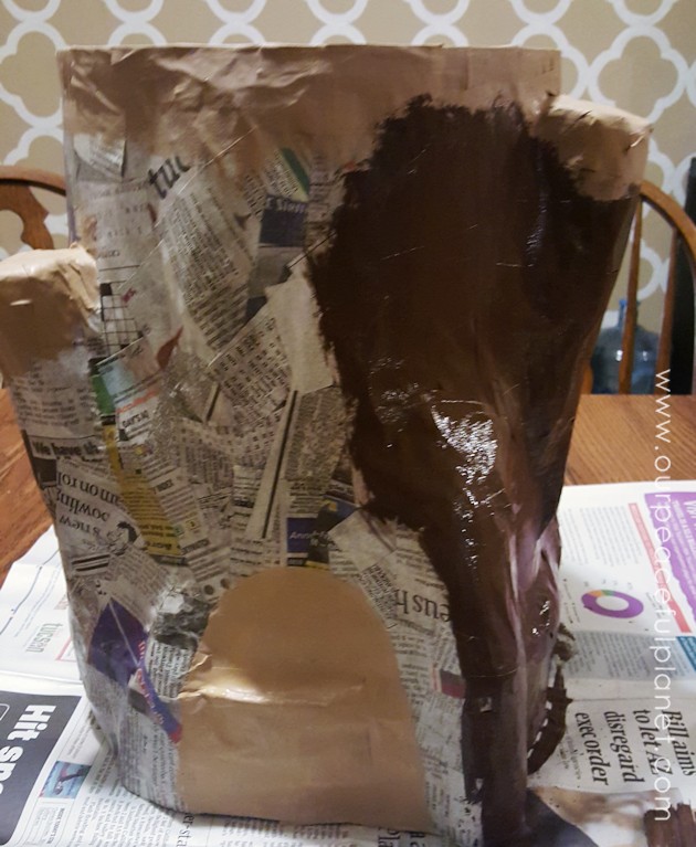 Add some whimsy to your home with this DIY tree stump stool. Remember using paper mache in grammar school? That's what creates the stump effect and it's easier than you think!