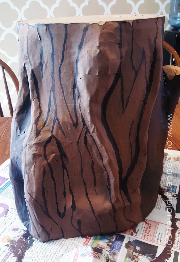 Add some whimsy to your home with this DIY tree stump stool. Remember using paper mache in grammar school? That's what creates the stump effect and it's easier than you think!