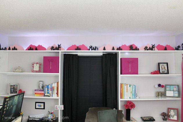 Grab the free printables and make these unique and inexpensive paper town shelf sitters! They will add a bit of whimsy to any room and only cost pennies.