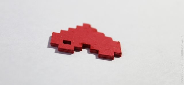 This pixel heart necklace is incredibly easy to make. All you need is some cardstock, glue and our free pattern. You'll be wearing retro jewelry in no time!