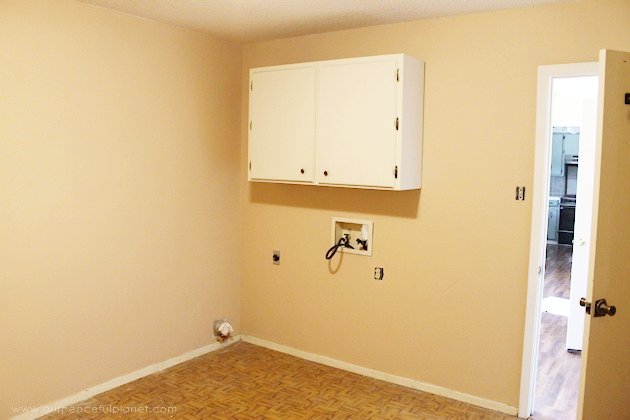 We made a simple room divider and turned a laundry room into a laundry slash home library that has a global feel and you won't believe how easy it was!