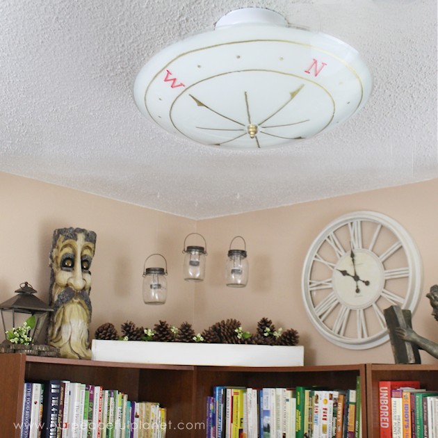 We made a simple room divider and turned a laundry room into a laundry slash home library that has a global feel and you won't believe how easy it was!
