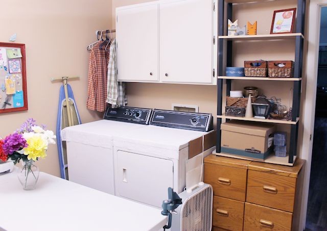 We made a simple room divider and turned a laundry room into a laundry slash home library that has a global feel and you won't believe how easy it was!