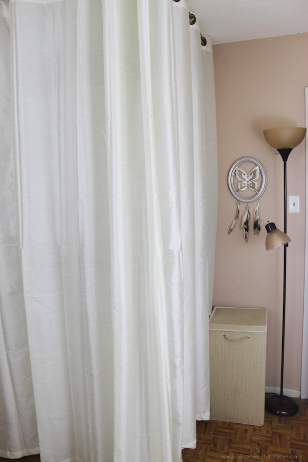 We made a simple room divider and turned a laundry room into a laundry slash home library that has a global feel and you won't believe how easy it was!