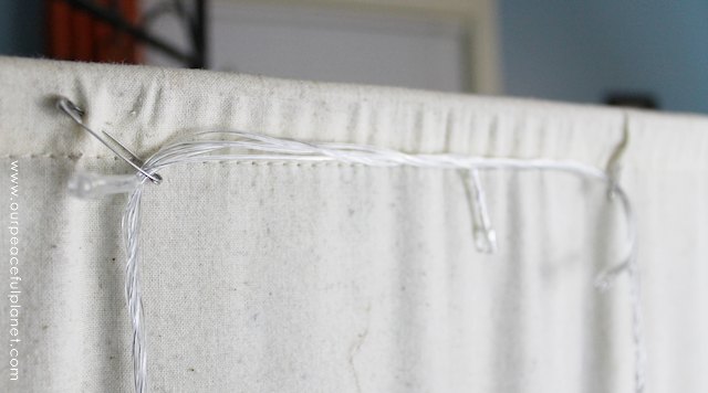 You can never have too many twinkle lights! Learn how to transform a plain room divider into something magical with some twinkle lights and safety pins!