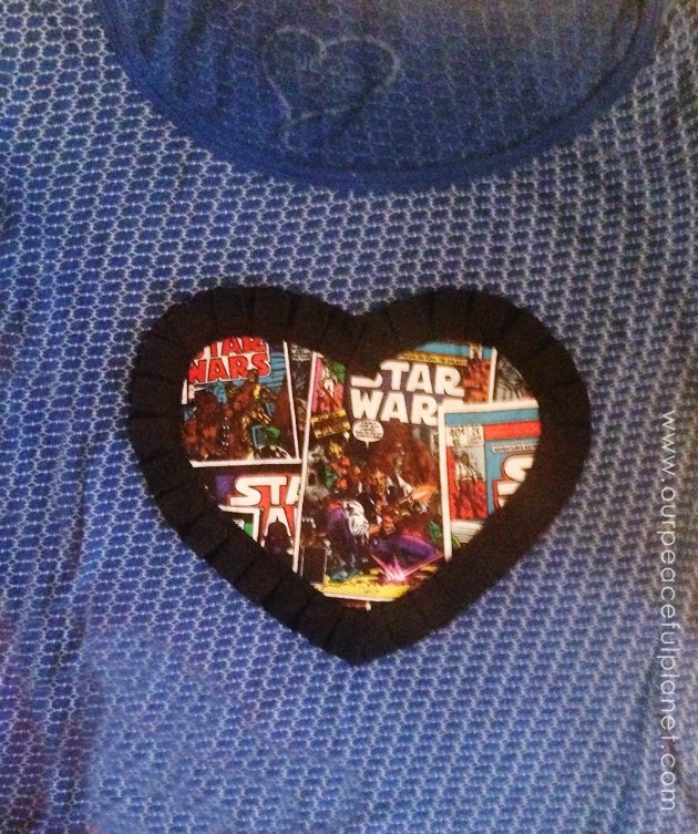 Create and wear a Star Wars T-shirt with pride! Grab a shirt, a scrap of Star Wars material and some fabric edging. You can use fabric glue or sew it on.