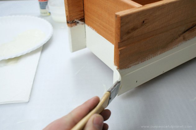 This DIY table centerpiece allows you to change decor year round for any occasion. Then lift out the pegboard insert to find candles for ambient lighting!