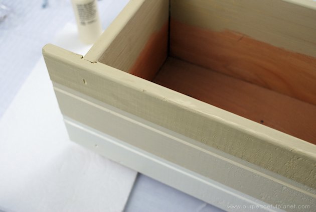 This DIY table centerpiece allows you to change decor year round for any occasion. Then lift out the pegboard insert to find candles for ambient lighting!