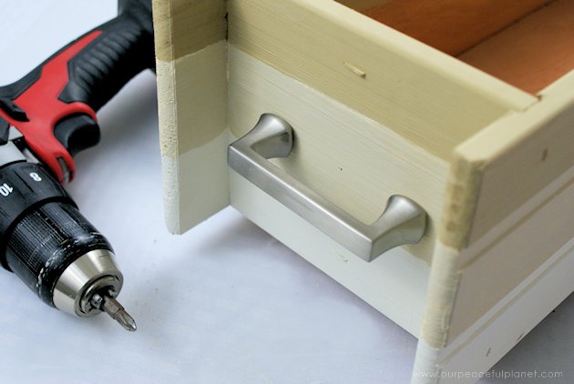 This DIY table centerpiece allows you to change decor year round for any occasion. Then lift out the pegboard insert to find candles for ambient lighting!