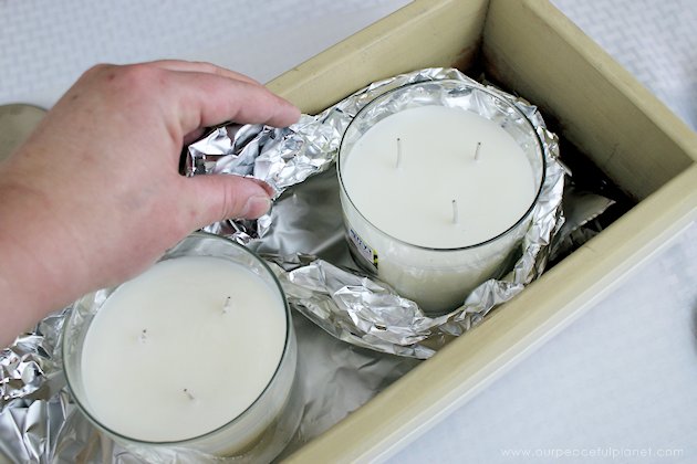 This DIY table centerpiece allows you to change decor year round for any occasion. Then lift out the pegboard insert to find candles for ambient lighting!