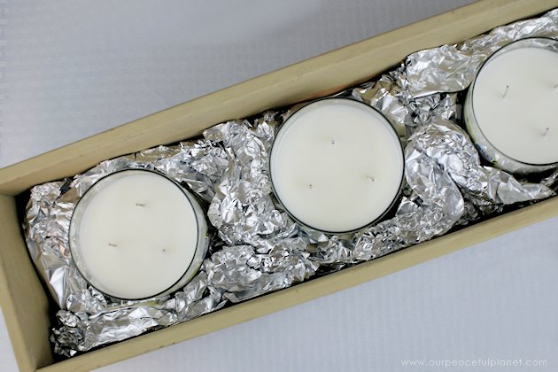 This DIY table centerpiece allows you to change decor year round for any occasion. Then lift out the pegboard insert to find candles for ambient lighting!