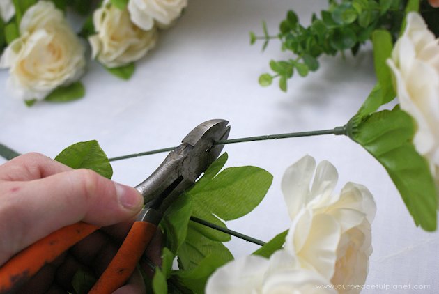 This DIY table centerpiece allows you to change decor year round for any occasion. Then lift out the pegboard insert to find candles for ambient lighting!