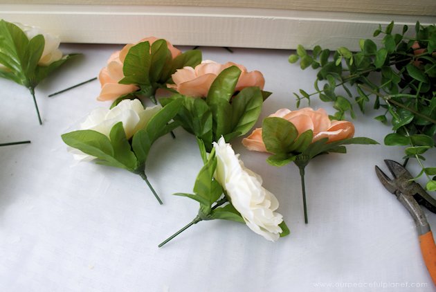 This DIY table centerpiece allows you to change decor year round for any occasion. Then lift out the pegboard insert to find candles for ambient lighting!