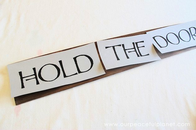 This simple medieval "Hold the Door" sign is part of our Over the Door Decor series. Easy plaques you create to send you out the door with a smile. 