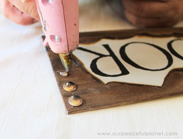This simple medieval "Hold the Door" sign is part of our Over the Door Decor series. Easy plaques you create to send you out the door with a smile. 
