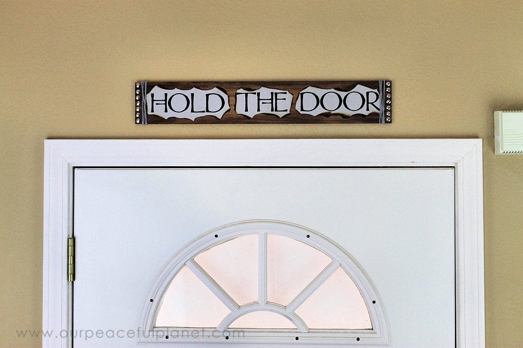 This simple medieval "Hold the Door" sign is part of our Over the Door Decor series. Easy plaques you create to send you out the door with a smile. 
