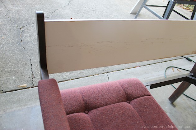 Watch how two $2 thrift store office chairs were transformed into a gorgeous comfy bench seat with nothing more than some paint and $6.00 of material.