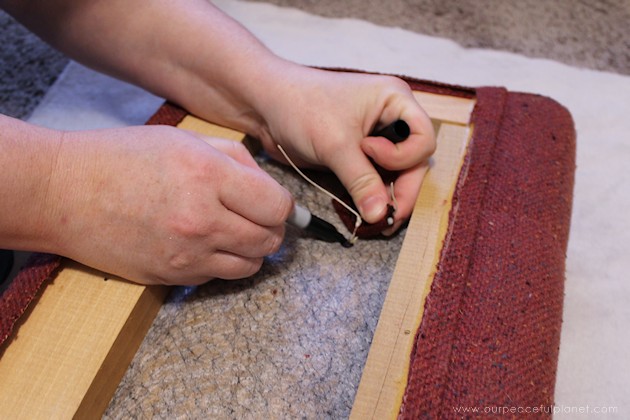Watch how two $2 thrift store office chairs were transformed into a gorgeous comfy bench seat with nothing more than some paint and $6.00 of material.