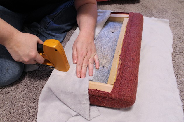 Watch how two $2 thrift store office chairs were transformed into a gorgeous comfy bench seat with nothing more than some paint and $6.00 of material.