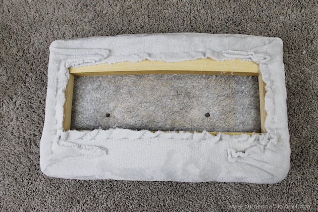 Watch how two $2 thrift store office chairs were transformed into a gorgeous comfy bench seat with nothing more than some paint and $6.00 of material.