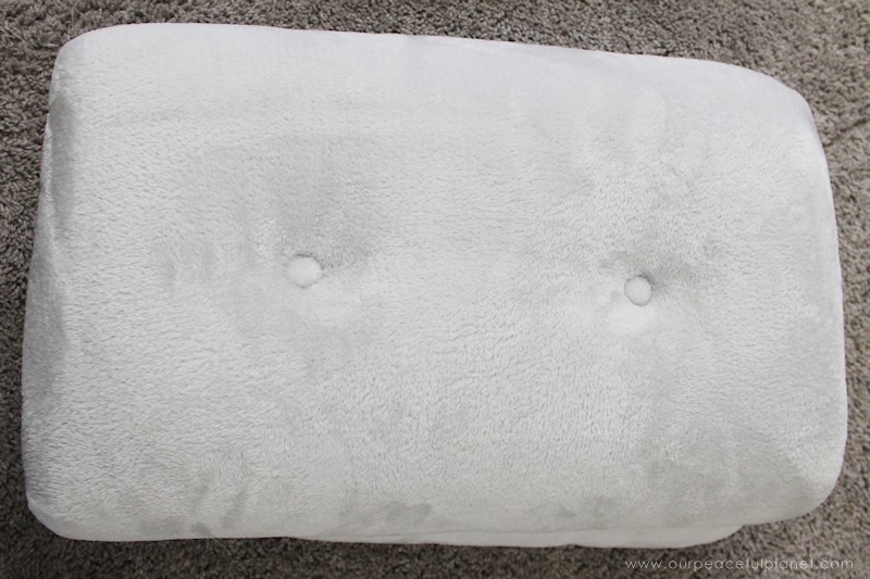 Watch how two $2 thrift store office chairs were transformed into a gorgeous comfy bench seat with nothing more than some paint and $6.00 of material.