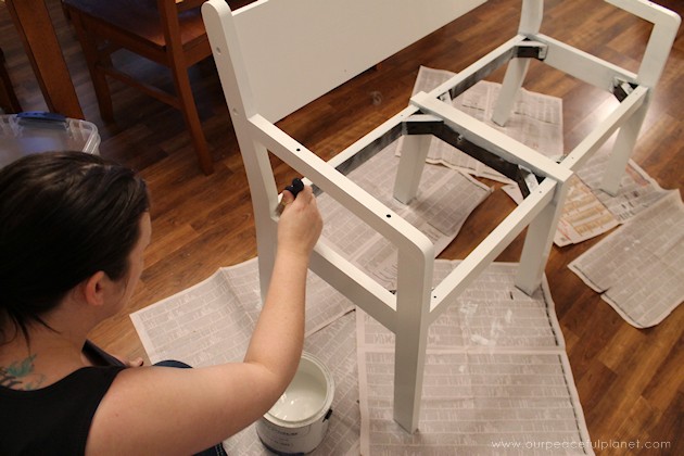 Watch how two $2 thrift store office chairs were transformed into a gorgeous comfy bench seat with nothing more than some paint and $6.00 of material.
