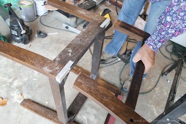 Watch how two $2 thrift store office chairs were transformed into a gorgeous comfy bench seat with nothing more than some paint and $6.00 of material.