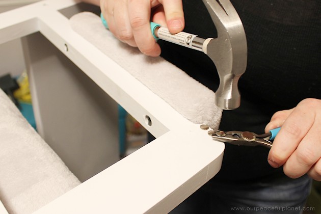 Watch how two $2 thrift store office chairs were transformed into a gorgeous comfy bench seat with nothing more than some paint and $6.00 of material.
