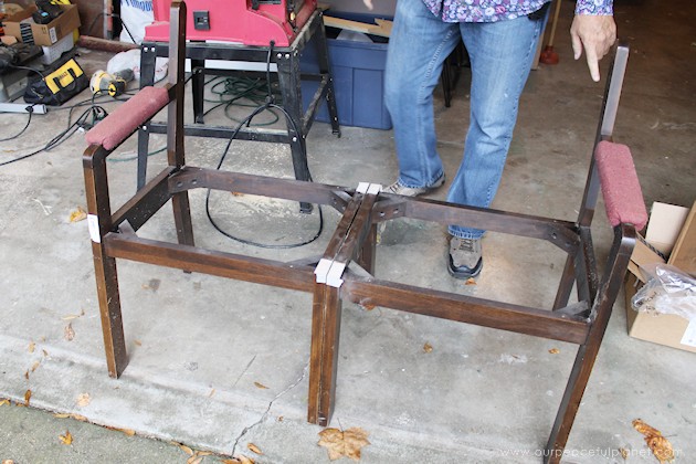 Watch how two $2 thrift store office chairs were transformed into a gorgeous comfy bench seat with nothing more than some paint and $6.00 of material.