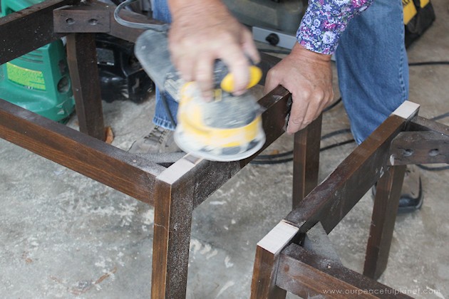 Watch how two $2 thrift store office chairs were transformed into a gorgeous comfy bench seat with nothing more than some paint and $6.00 of material.